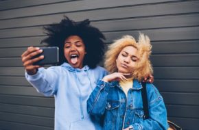 Two young women take a selfie together