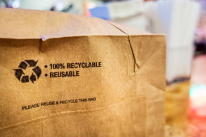 A close-up image of a recyclable brown paper bag